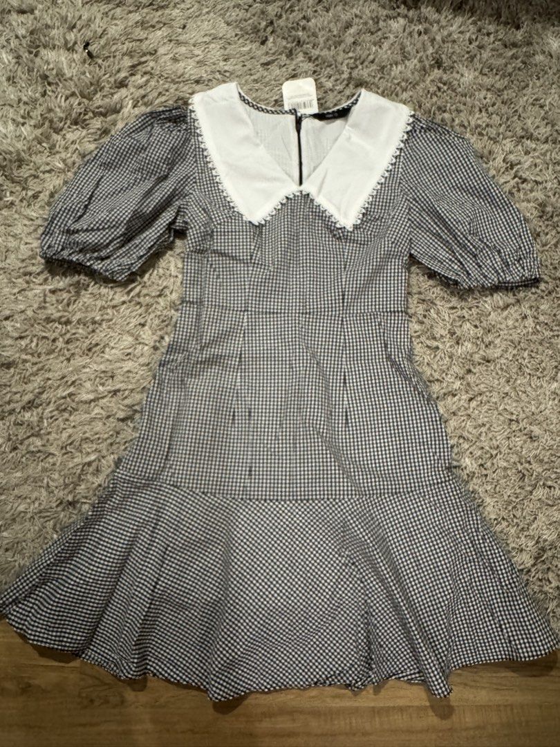 MARC Black White Gingham Peter Pan Collar Dress (Category: Dresses) located in Caloocan City. Submitted by newcrystal_3b43ba (Listing ID 1467743341, Image 1). Description: - Brand: MARC - Condition: Brand new with original store tag - Pattern: Black and white gingham - Design details: Large white Peter Pan collar with lace trim, puff sleeves, and flared ruffle hem - Closure: Back zipper.