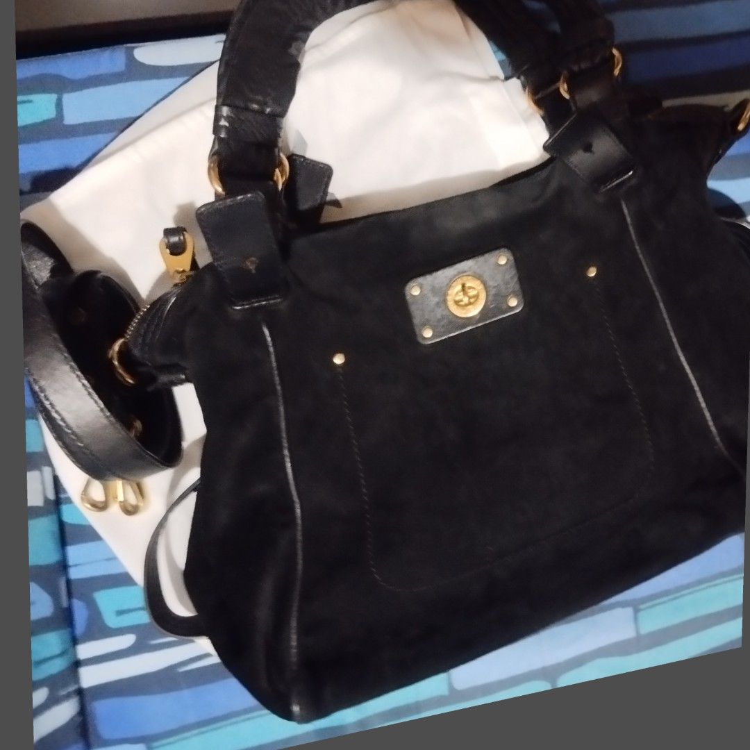 Marc by Marc Jacobs Black Suede Handbag (Category: Luxury Bags & Wallets) located in Manila. Submitted by lene48 (Listing ID 1467729977, Image 1). Description: - Brand: Marc by Marc Jacobs - Material: Black suede exterior with signature B&W logo fabric lining - Hardware: Gold-tone - Compartments: Spacious interior with front turn-lock pocket - Straps: Dual leather top handles and adjustable shoulder strap - Origin: Made in Indonesia - Inclusion: 