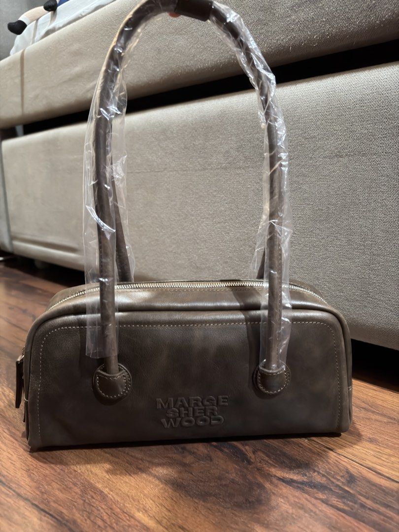 MARGE SHERWOOD Soft Boston EW (Category: Luxury Bags & Wallets) located in Cebu City. Submitted by huff.puff (Listing ID 1459185997, Image 2). Description: - Authentic from Korea 💯 - Brand new ✨ - Comes complete with original dust bag and authenticity and care card - Color: Washed brown pull-up - Retails for Php 23k ✨ Last 4 photos ctto for reference only 🤍 ✨ charms not for sale.