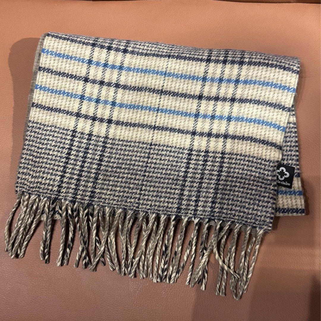 Marie Claire Plaid Winter Scarf (Category: Scarves) located in Rizal. Submitted by houseofbell (Listing ID 1467607819, Image 2). Description: - Brand: Marie Claire - Design: Reversible plaid (grey, beige, and blue) on one side and solid grey on the other - Details: Fringed ends with a branded label near the edge - Material/Feel: Soft winter accessory for ultimate warmth and comfort - Condition: Excellent pre-loved / brand new (ready to wear).