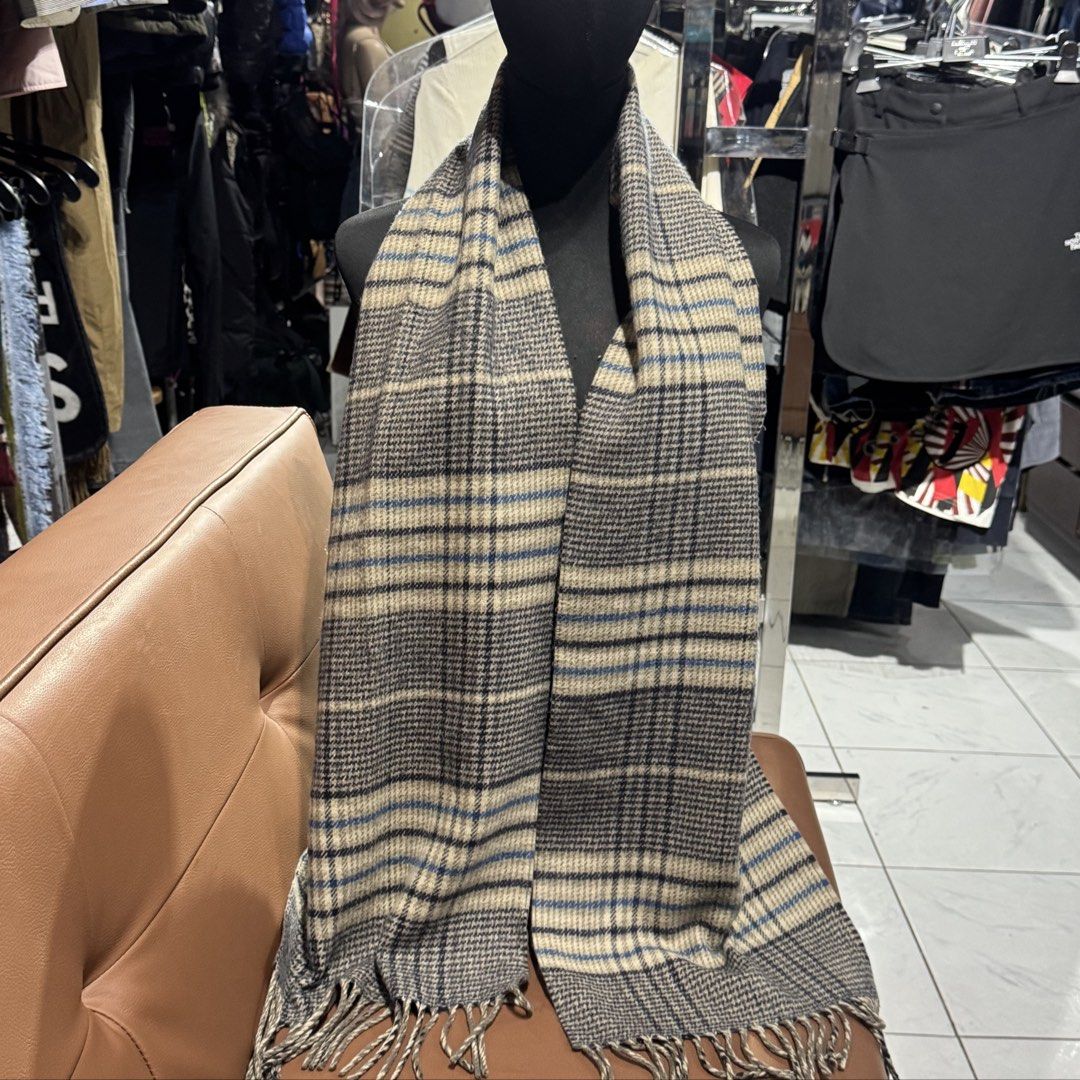 Marie Claire Plaid Winter Scarf (Category: Scarves) located in Rizal. Submitted by houseofbell (Listing ID 1467607819, Image 3). Description: - Brand: Marie Claire - Design: Reversible plaid (grey, beige, and blue) on one side and solid grey on the other - Details: Fringed ends with a branded label near the edge - Material/Feel: Soft winter accessory for ultimate warmth and comfort - Condition: Excellent pre-loved / brand new (ready to wear).