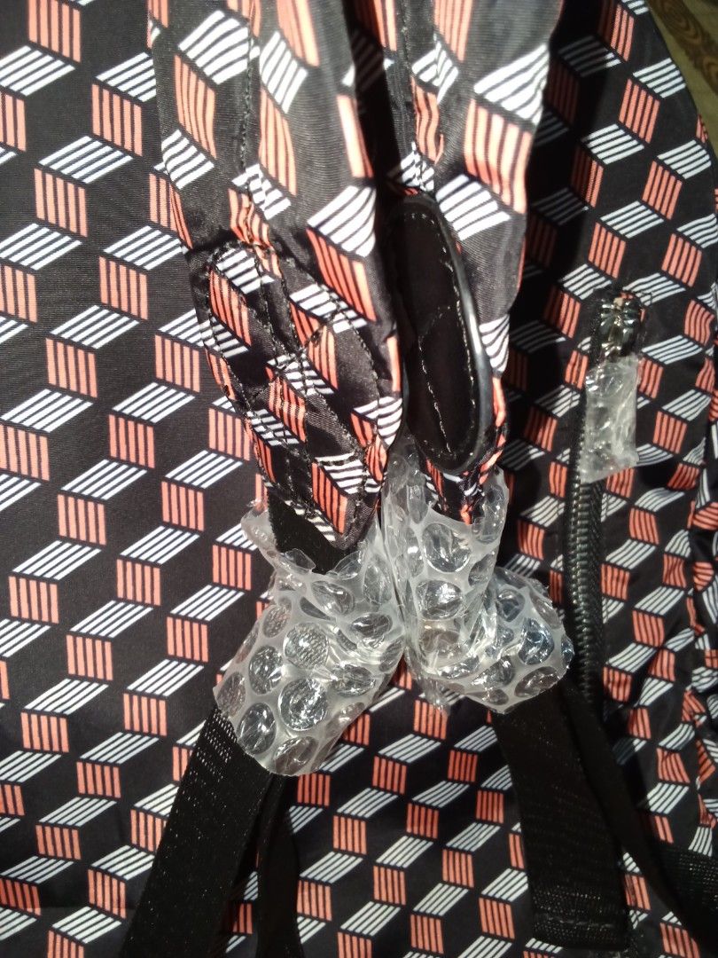 Mario By Mario Jacobus Geometric Pattern Backpack (Category: Backpacks) located in Nagcarlan. Submitted by irishcasta73122 (Listing ID 1467838543, Image 3). Description: from Japan inspired by marc Jacobs slightly negotiable never been use - Brand: Mario By Mario Jacobus Standard Supply (Type Workwear) - Design: Black with a bold red and white geometric cube pattern - Storage: Multiple exterior zippered compartments and an inner zippered pocket -