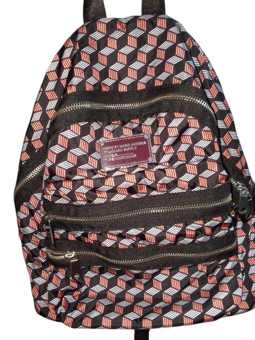 Mario By Mario Jacobus Geometric Pattern Backpack (Category: Backpacks) located in Nagcarlan. Submitted by irishcasta73122 (Listing ID 1467838543, Image 1). Description: from Japan inspired by marc Jacobs slightly negotiable never been use - Brand: Mario By Mario Jacobus Standard Supply (Type Workwear) - Design: Black with a bold red and white geometric cube pattern - Storage: Multiple exterior zippered compartments and an inner zippered pocket -