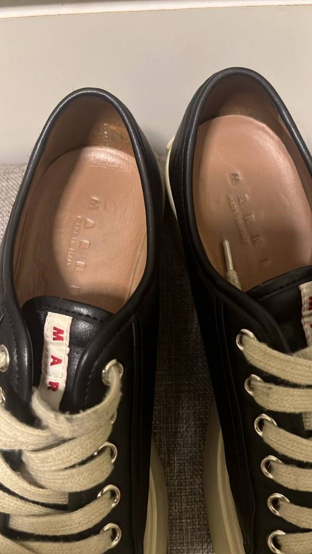 Marni Black Platform Sneakers (Category: Sneakers) located in Manila. Submitted by mine_n_sell (Listing ID 1467707771, Image 3). Description: - Brand: Marni - Style: Black leather low top platform sneakers - Soles: Thick cream rubber platform with red Marni logo lettering on heel counters - Details: White laces, matching tongue labels, and 'Made in Italy' interior branding - Condition: Normal wear on midsoles Authentic 26 CM Shipping every Saturd