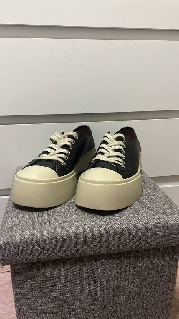 Marni Black Platform Sneakers (Category: Sneakers) located in Manila. Submitted by mine_n_sell (Listing ID 1467707771, Image 1). Description: - Brand: Marni - Style: Black leather low top platform sneakers - Soles: Thick cream rubber platform with red Marni logo lettering on heel counters - Details: White laces, matching tongue labels, and 'Made in Italy' interior branding - Condition: Normal wear on midsoles Authentic 26 CM Shipping every Saturd