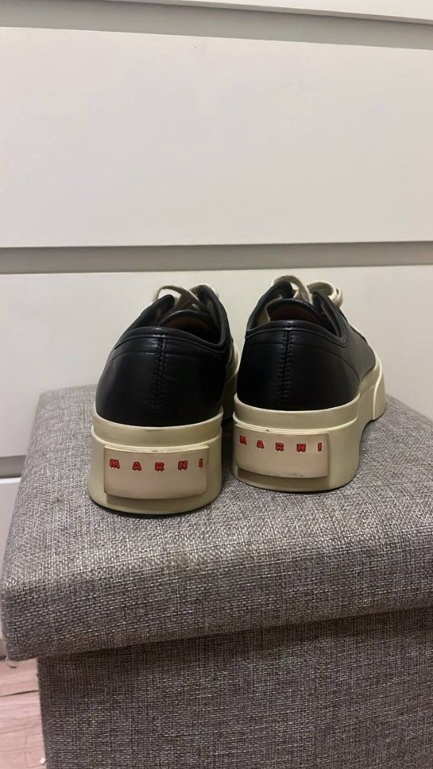 Marni Black Platform Sneakers (Category: Sneakers) located in Manila. Submitted by mine_n_sell (Listing ID 1467707771, Image 2). Description: - Brand: Marni - Style: Black leather low top platform sneakers - Soles: Thick cream rubber platform with red Marni logo lettering on heel counters - Details: White laces, matching tongue labels, and 'Made in Italy' interior branding - Condition: Normal wear on midsoles Authentic 26 CM Shipping every Saturd