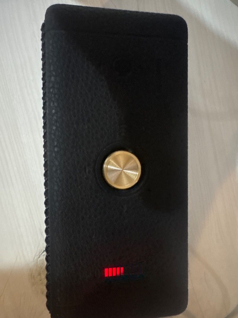 Marshall Emberton (Read Description) (Category: Soundbars, Speakers & Amplifiers) located in Caloocan City. Submitted by oddlion.899135 (Listing ID 1467477970, Image 2). Description: - Brand: Marshall - Color: Classic black - Sound Quality: Surprisingly powerful audio output for a small unit - Condition: Clean grille, no major scratches, and despite the issues sound quality is this good - RFS: Decluttering / upgrading gear - Issues: When on max v