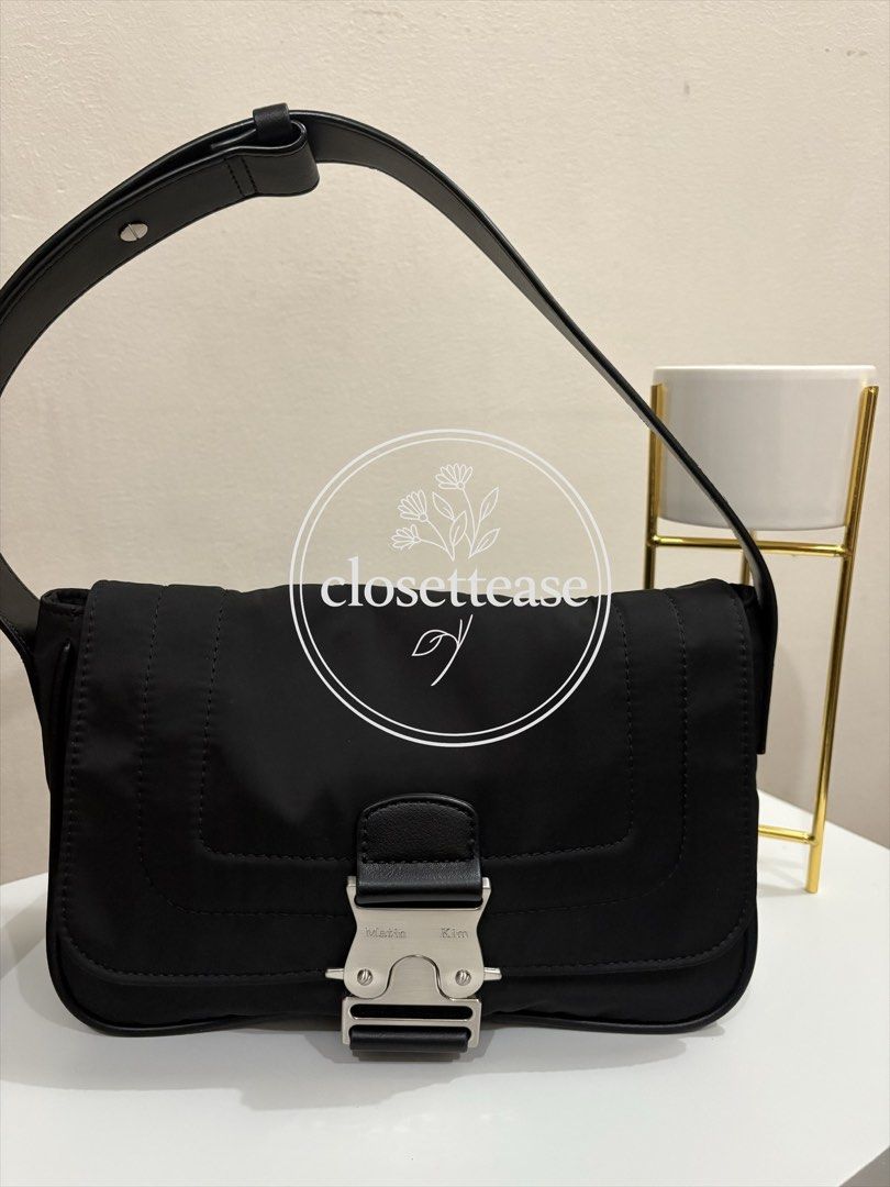 Matin Kim Nylon Bag (Category: Shoulder Bags) located in Manila. Submitted by closettease (Listing ID 1467612141, Image 1). Description: Small size but can fit long wallet, secured lock closure. Guaranteed original, moneyback 💜 Send pm for more pictures, not including all of the photos here to avoid photo grabbing 🤍.
