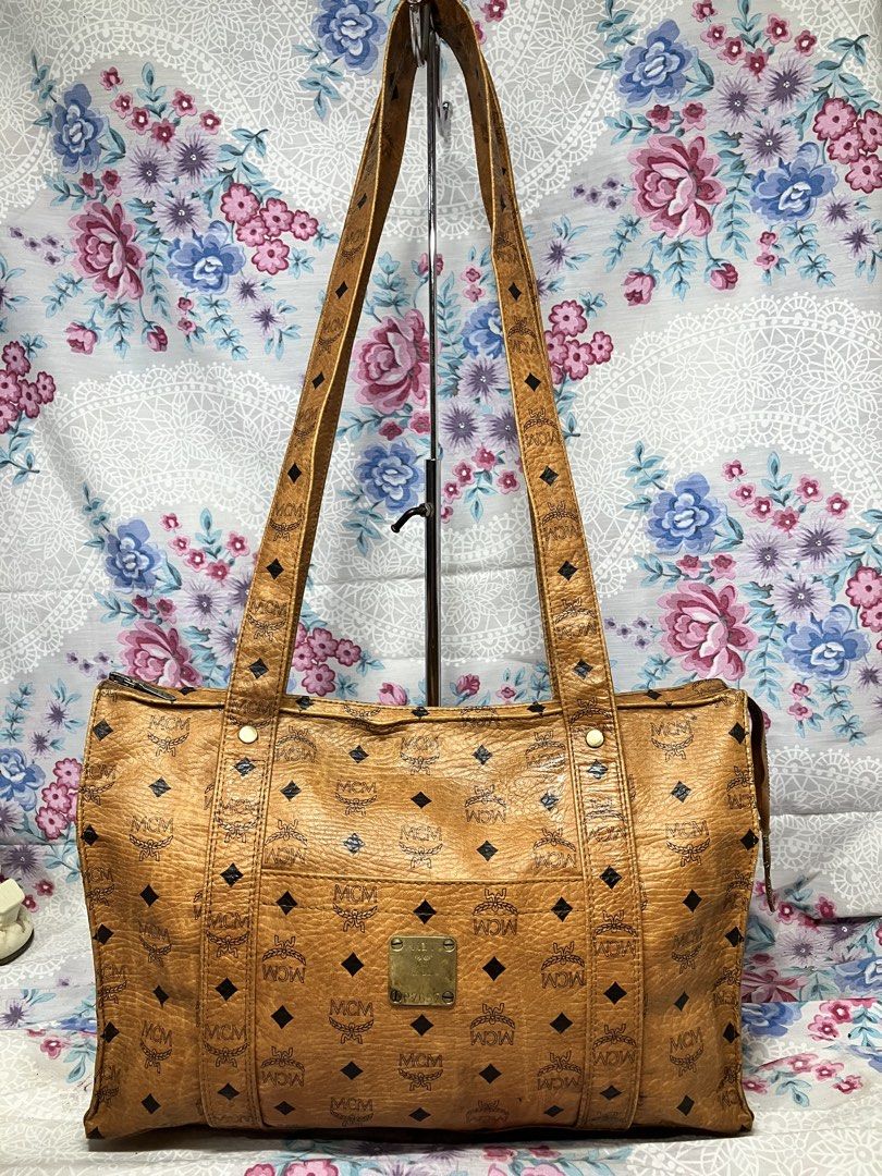 MCM COGNAC VISETOS COATED CANVAS SHOULDER BAG (Category: Tote Bags) located in General Mariano Alvarez. Submitted by adonid (Listing ID 1467646488, Image 1). Description: MCM COGNAC VISETOS COATED CANVAS SHOULDER BAG GOOD CONDITION NORMAL SIGN OF USAGE ONLY .