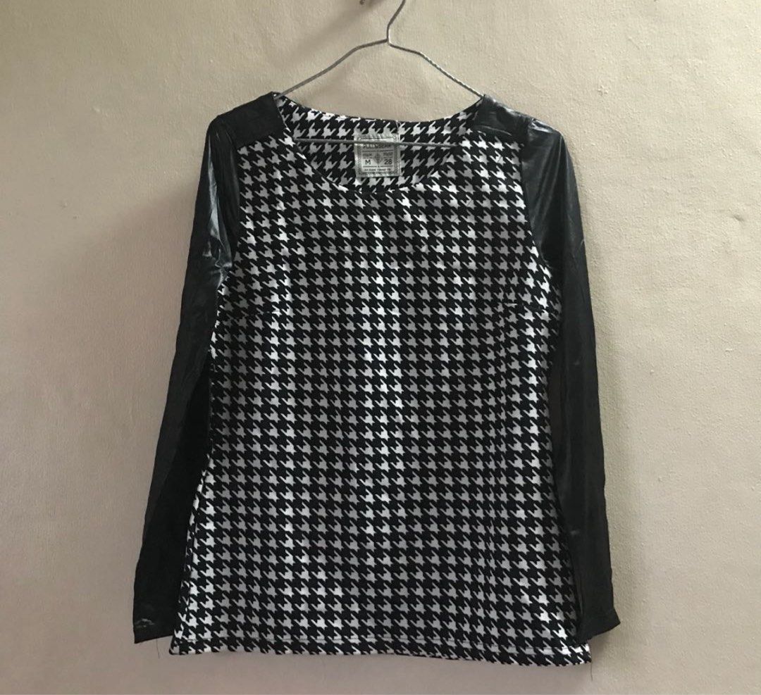 Medium Pull&Bear Houndstooth Top with Faux Leather Sleeves (Category: Blouses) located in Marikina City. Submitted by lovegoeson (Listing ID 1467608280, Image 1). Description: - Brand: Pull&Bear - Size: M (fits true to size) - Design: Classic black and white houndstooth body with long black faux leather sleeves - Neckline: Round neck - Fabric: Comfortable textured material - Styling: Easy to match with jeans or skirts for casual or edgy outfits -