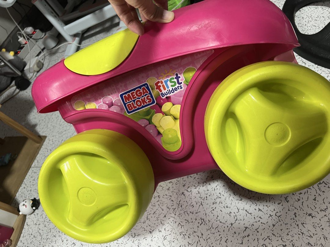 Mega Bloks First Builders Pink Toy Wagon with Blocks (Category: Kids Toys) located in Quezon City. Submitted by prelovedbyjmy (Listing ID 1467681457, Image 2). Description: - Mega Bloks push-and-pull toy wagon in fun pink and lime green colors - Features a built-in building plate right on the handle - Includes a spacious storage compartment filled with colorful blocks - Big chunky wheels make it easy for toddlers to roll around - Great for active