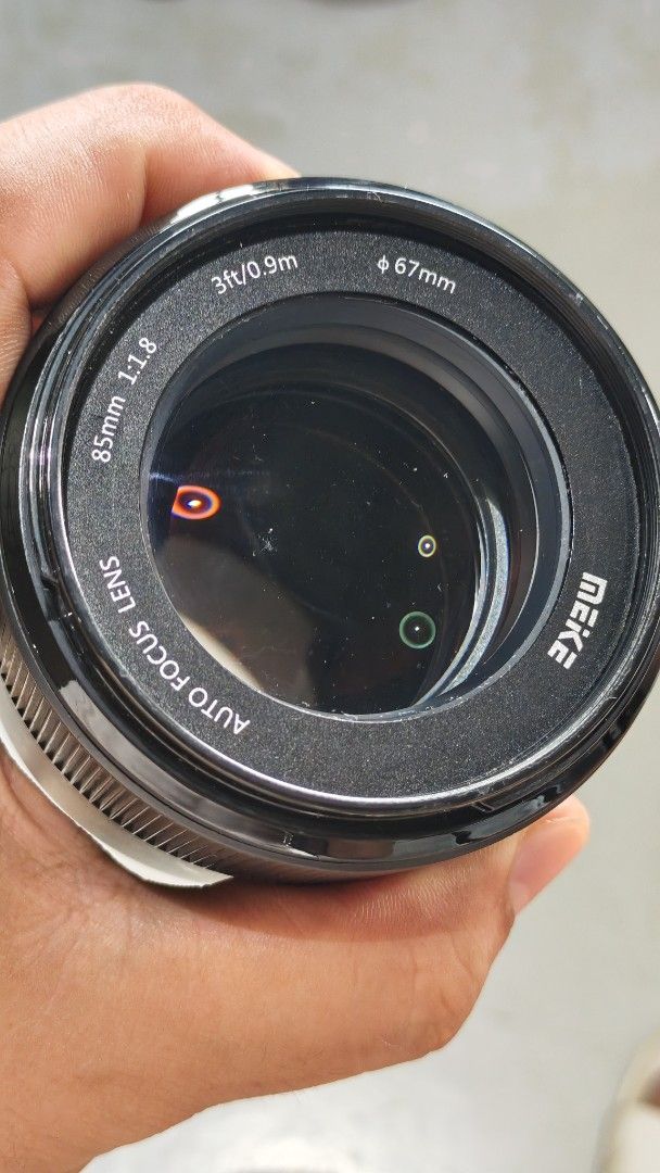 Meike 85mm 1.8 fuji x mount (Category: Cameras) located in Manila. Submitted by eyey02 (Listing ID 1467654665, Image 3). Description: - Brand/Model: Meike 85mm f/1.8 FF STM Auto Focus Lens - Mount Type: Fujifilm X-Mount - Condition: Minor signs of usage, excellent working condition, glass has a spot of fungus and minor dust - Included: Kenko UV 67mm filter (Japan) for extra lens protection - Key Features: Fast f/1.8 aperture for gorgeous backgrou