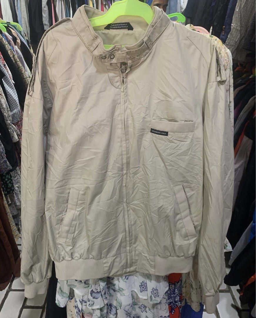 Members Only Vintage Beige Jacket Size M (Category: Coats, Jackets and Outerwear) located in Tagum. Submitted by knilevinc69480 (Listing ID 1467660708, Image 1). Description: - Brand: Members Only - Color: Beige - Size: Medium (M) - Style: Classic racer jacket with snap strap collar, front zipper, and chest pocket with signature label - Details: Knit ribbed cuffs and hem - Material: Cotton blend, machine washable - Condition: Clean, classic look 
