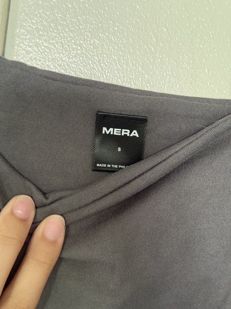 MERA Grey Square Neck Tank Top Size S (Category: Sleeveless) located in Iloilo. Submitted by trixiaaa18 (Listing ID 1467626477, Image 2). Description: - Brand: MERA - Color: Grey - Size: S - Design: Square neckline with thick straps - Material: Soft, stretchy fabric - Origin: Made in the Philippines.