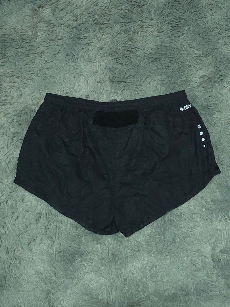 Merrell M-Dry Black Running Shorts with Back Pocket (Category: Activewear) located in Abulug. Submitted by humanwhosellthings (Listing ID 1467734278, Image 2). Description: - Brand: Merrell Womens Running Short ✅Excellent Condition ✅Issue: none ▫️Waist Size: 28-36 ▫️Length: 10 - Color: Black with a subtle abstract pattern - Technology: M-Dry fabric to keep you cool and dry - Fit: Comfortable elastic waistband with grey adjustable drawstring - Sto