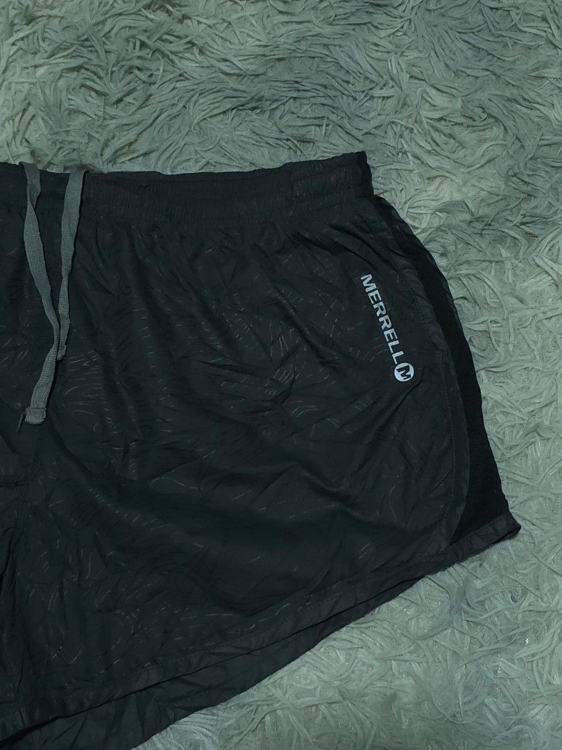 Merrell M-Dry Black Running Shorts with Back Pocket (Category: Activewear) located in Abulug. Submitted by humanwhosellthings (Listing ID 1467734278, Image 3). Description: - Brand: Merrell Womens Running Short ✅Excellent Condition ✅Issue: none ▫️Waist Size: 28-36 ▫️Length: 10 - Color: Black with a subtle abstract pattern - Technology: M-Dry fabric to keep you cool and dry - Fit: Comfortable elastic waistband with grey adjustable drawstring - Sto