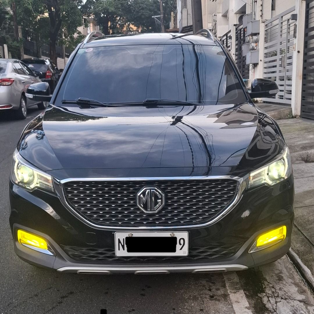 MG ZS (Category: Used Cars) located in Marikina City. Submitted by lawrencen123 (Listing ID 1467775556, Image 1). Description: Selling my 2020 MG ZS Style Plus Gas & Go! 1.5L Gas engine A/T (w/ Sports Mode and Manual Mode) 48k+ kms Meteorite Black Registered until September 2027 Clean papers ready for transfer Upgrades: HKS Grounding Kit LED Headlights Tri-Color LED Fog Lights Ceramic Tint New tires (1 year old with deep tread depth remaining) Ne