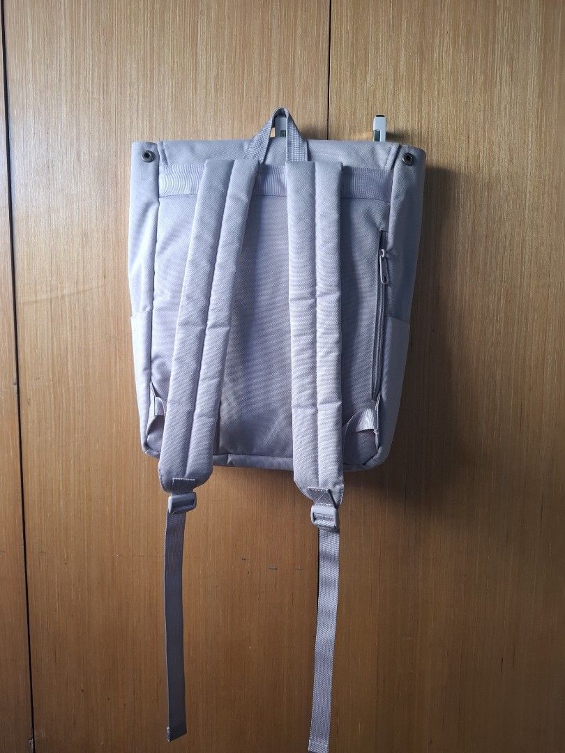 MHL. backpack grey/lavender (Category: Backpacks) located in Pasay City. Submitted by emilia1102 (Listing ID 1467787662, Image 2). Description: - Brand: MHL - Material: Durable grey canvas - Design: Foldover front flap with snap closure and subtle brand logo - Comfort: Padded shoulder straps with adjustable sliders - Storage: Horizontal zipper pocket on the back panel for quick access - Price: Grab it now for only ₱500 (Original retail: ₱1,386) -