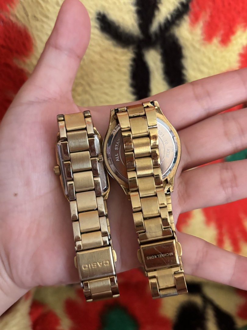 Michael Kors and Casio Gold Watch Bundle (Category: Women's Watches) located in Manila. Submitted by tiffanyyyy09 (Listing ID 1467742882, Image 3). Description: - 2-in-1 gold-tone watch bundle - 1st watch: Michael Kors round face with textured glitter dial - 2nd watch: Casio rectangular face with black dial and stainless steel back - Both feature link bracelets with standard deployment clasps - Condition: Visible surface wear and scuffs on both b