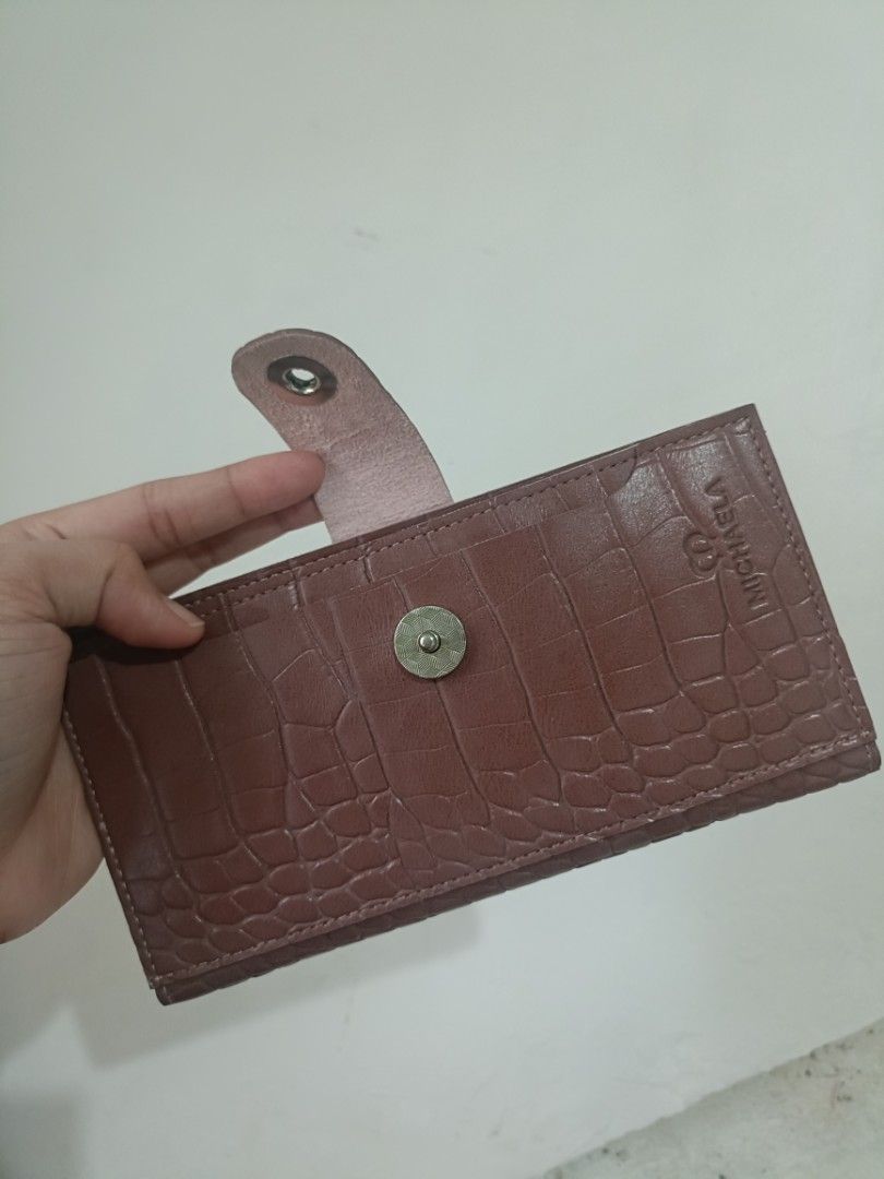 MICHAELA Crocodile Texture Long Wallet (Category: Wallets & Card holders) located in Las Pinas. Submitted by lovedbyazianh (Listing ID 1467729825, Image 3). Description: MICHAELA long wallet. Textured faux crocodile finish all over with a snap button closure. Inside has plenty of card slots and a clear ID window. Clean lining, nice structured shape..