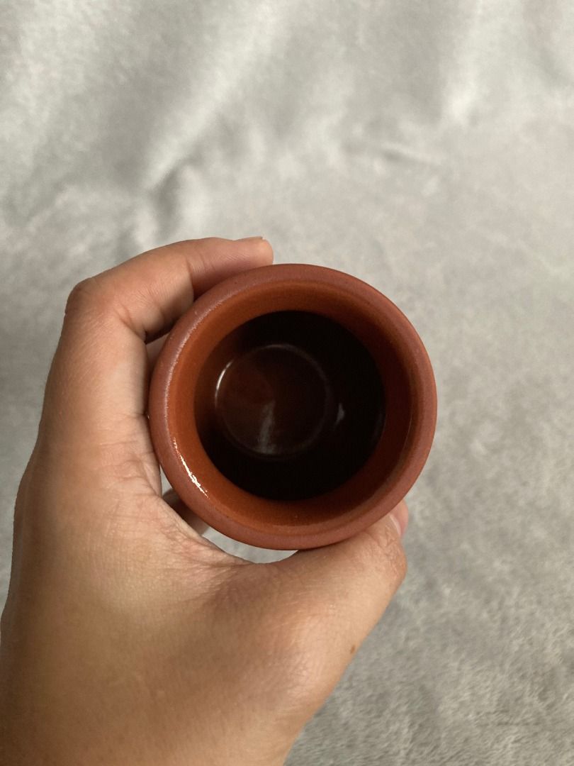 Mini terracotta pot small ceramic vase (Category: Vases & Decorative Bowls) located in Rizal. Submitted by sheeraay (Listing ID 1467704073, Image 2). Description: - Material: Reddish-brown terracotta clay with a smooth glazed interior - Size: Palm-sized, lightweight mini planter - Design: Classic rounded body with a flared rim - Condition: Clean inside and out - Ideal for: Tiny desk plants, succulents, or small props.