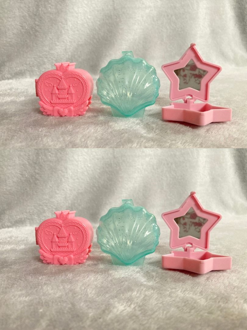Mini toy containers (Category: Designer & Blind Box Toys) located in Rizal. Submitted by sheeraay (Listing ID 1467704357, Image 2). Description: - Design: Star-shaped pink plastic compact mirror with a secure button fastener - Interior: Features a small mirror on top and a smooth purple base - Portability: Lightweight and pocket-sized, ideal for travel and quick touch-ups - Condition: Clean, well-maintained, and opens/closes smoothly.