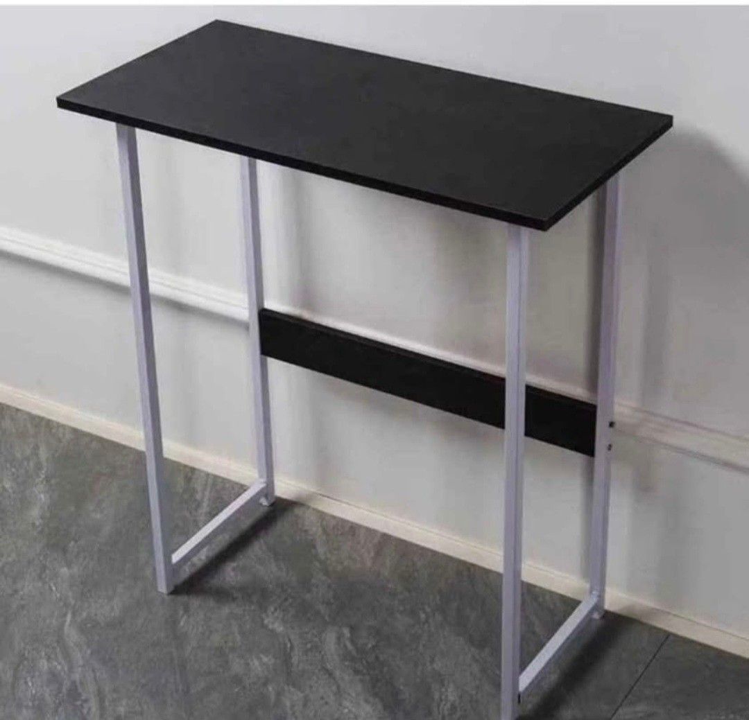 Minimalist Black and White Study Desk Table (Category: Tables & Sets) located in Manila. Submitted by phoebecali (Listing ID 1467619127, Image 2). Description: - Modern study desk featuring a sleek black rectangular top and sturdy white metal legs - Built with a horizontal support bar underneath for extra stability and durability - Clean lines and versatile design, ideal for bedrooms, study rooms, or small home offices - Easy to style and match w