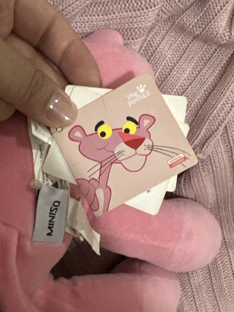Miniso Pink Panther Stuffed Toy (Category: Plushies & Soft Toys) located in Manila. Submitted by chantalbe69523 (Listing ID 1467725998, Image 3). Description: - Brand: Official Miniso Licensed Pink Panther - Condition: Brand new with original swing tags attached - Material: Ultra-soft pink fabric - Features: Classic sleepy eyes and bright red nose - Size: Standard medium - Ideal for: Gifting, collection, or cute room decor Needs cleaning lang.