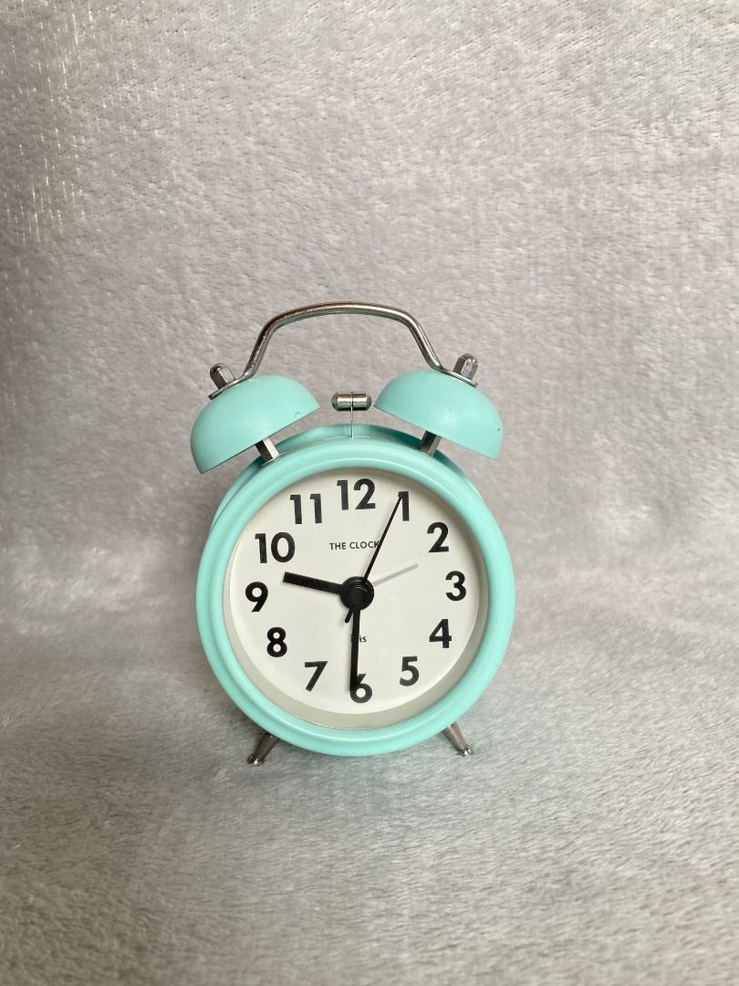 Mint green twin bell analog alarm clock (Category: Clocks) located in Rizal. Submitted by sheeraay (Listing ID 1467707310, Image 1). Description: - Color: Mint green with stylish silver accents - Design: Classic retro twin bell style - Display: White clock face with clear black numbers and hands - Alarm: Extra loud mechanical bell function to wake you up easily - Size: Compact and space-saving, ideal for bedside tables or desks - Power: Battery-o