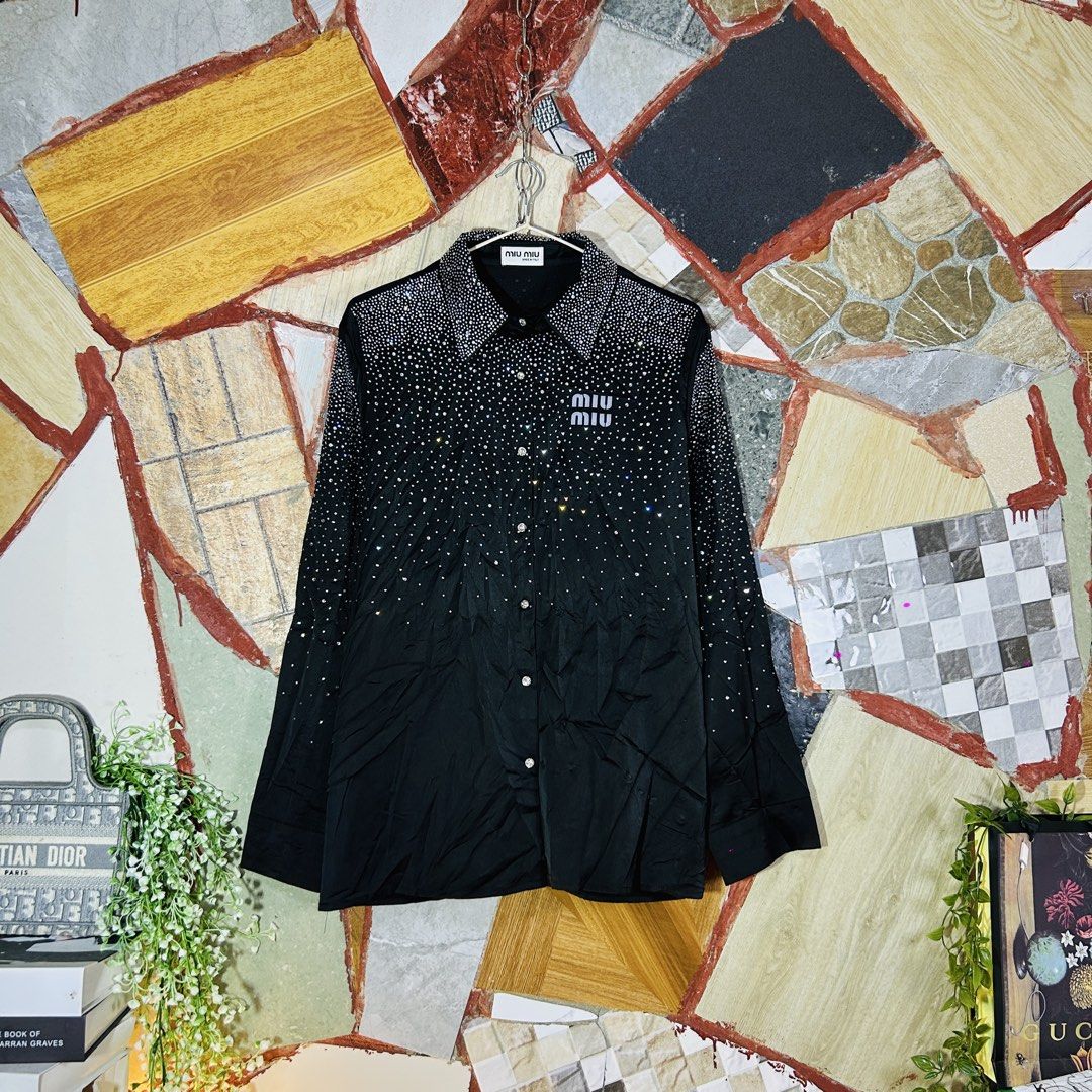 Miu miu button down long sleeve (Category: Luxury Apparel) located in Baguio. Submitted by kckc_luxury (Listing ID 1467753570, Image 2). Description: 🌸 TINY PINK SPOTS ARE LENS DAMAGE, NOT CLOTH STAINS ————————— ❗️KINDLY READ BEFORE MAKING AN OFFER❗️ LISTING DETAILS size:Large width x length (inches):22x29 condition: Good condition --- MOP: Gcash / BPI MOD: J&T / JRS LOCATION: Baguio City --- NOTE: • Manage your expectations • Photos did not go 
