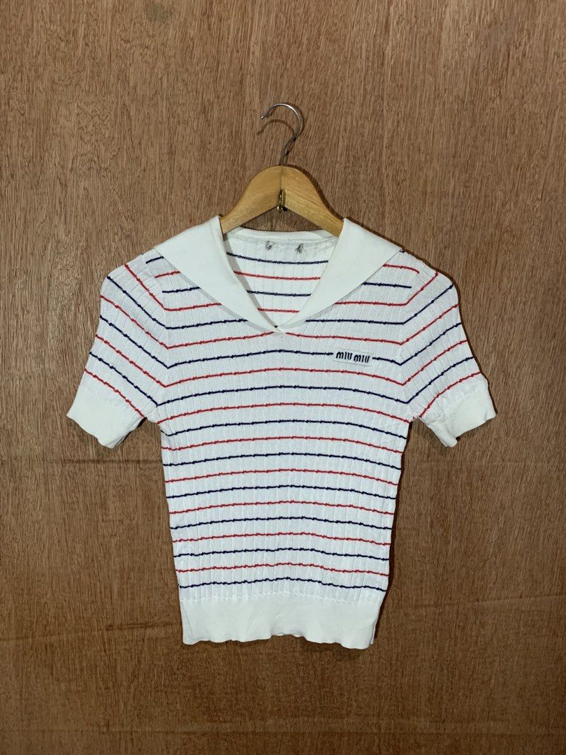 Miu Miu Striped Sailor Collar Knit Top (Category: Blouses) located in Tacurong. Submitted by ljsthrift (Listing ID 1467603205, Image 1). Description: - Brand: Miu Miu - Style: White knit top with red and blue horizontal stripes - Details: Sailor collar, V-neckline, embroidered brand logo patch on chest, ribbed hem and cuffs - Sleeves: Short sleeves - Interior Tag Code: AMAS 2020 1733 MMF441 1YVO - Condition: Excellent, well-maintained .