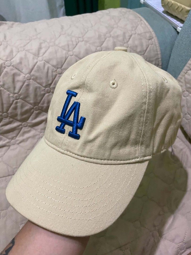 MLB Los Angeles Dodgers Beige Cap (Category: Caps & Hats) located in Quezon City. Submitted by elihur.tuazon (Listing ID 1467808879, Image 1). Description: - Color: Beige with embroidered blue LA logo - Details: MLB batter logo on the back - Fit: Adjustable strap with metal buckle closure (Free Size) - Condition: Clean fabric, ready to wear.