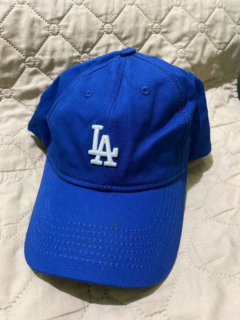 MLB Los Angeles Dodgers Blue Cap Hat (Category: Caps & Hats) located in Quezon City. Submitted by elihur.tuazon (Listing ID 1467808954, Image 1). Description: - Authentic MLB Los Angeles Dodgers baseball cap - Striking royal blue color with classic embroidered white LA logo - Adjustable strapback closure fitted with a secure silver metal clasp - Genuine quality featuring official MLB branded interior taping and tags - Versatile everyday accessory