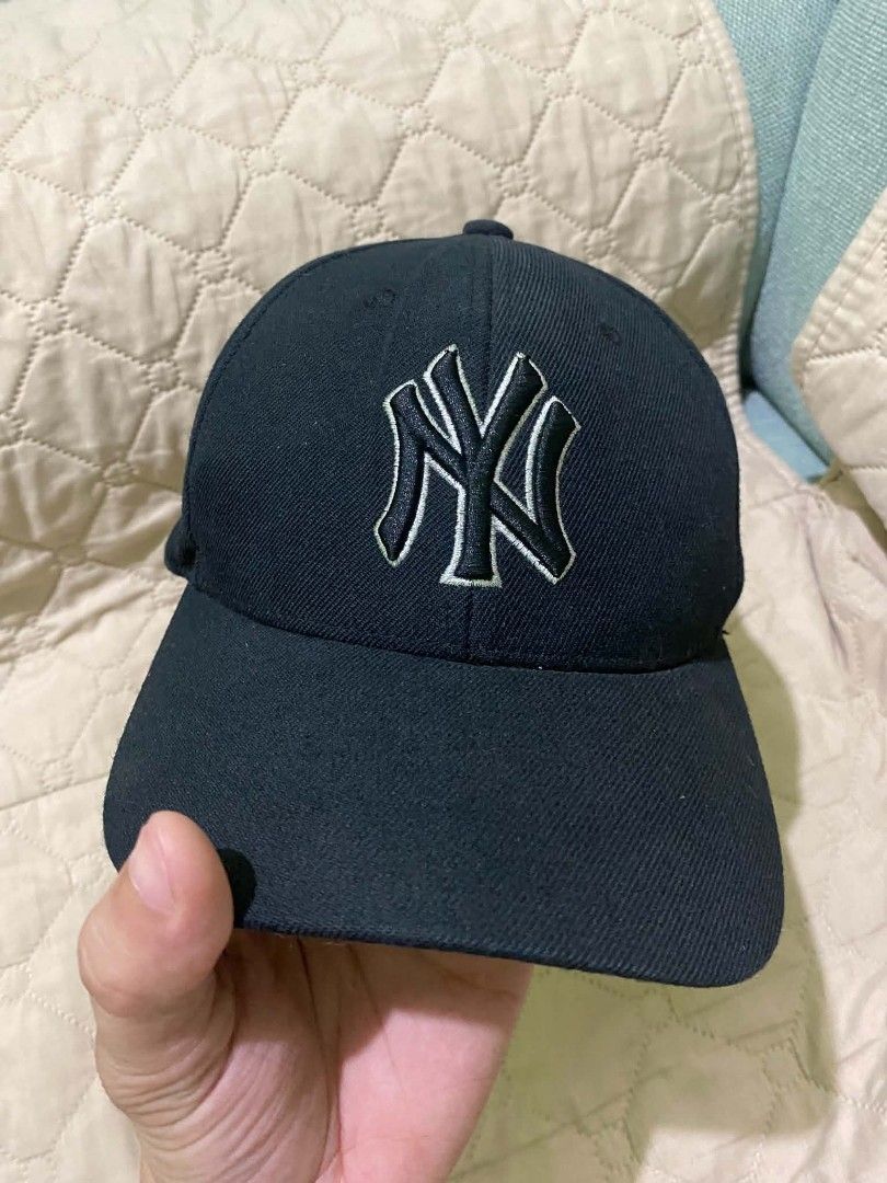 MLB New York Yankees Black Cap Hat (Category: Caps & Hats) located in Quezon City. Submitted by elihur.tuazon (Listing ID 1467808773, Image 1). Description: - Authentic MLB New York Yankees baseball cap in classic black - Embroidered NY logo on front, side patch, and detailed script under the brim - Adjustable strap closure with metal hardware for a custom fit - Free size (unisex) - Interior tags intact - Versatile everyday staple piece - Ships f