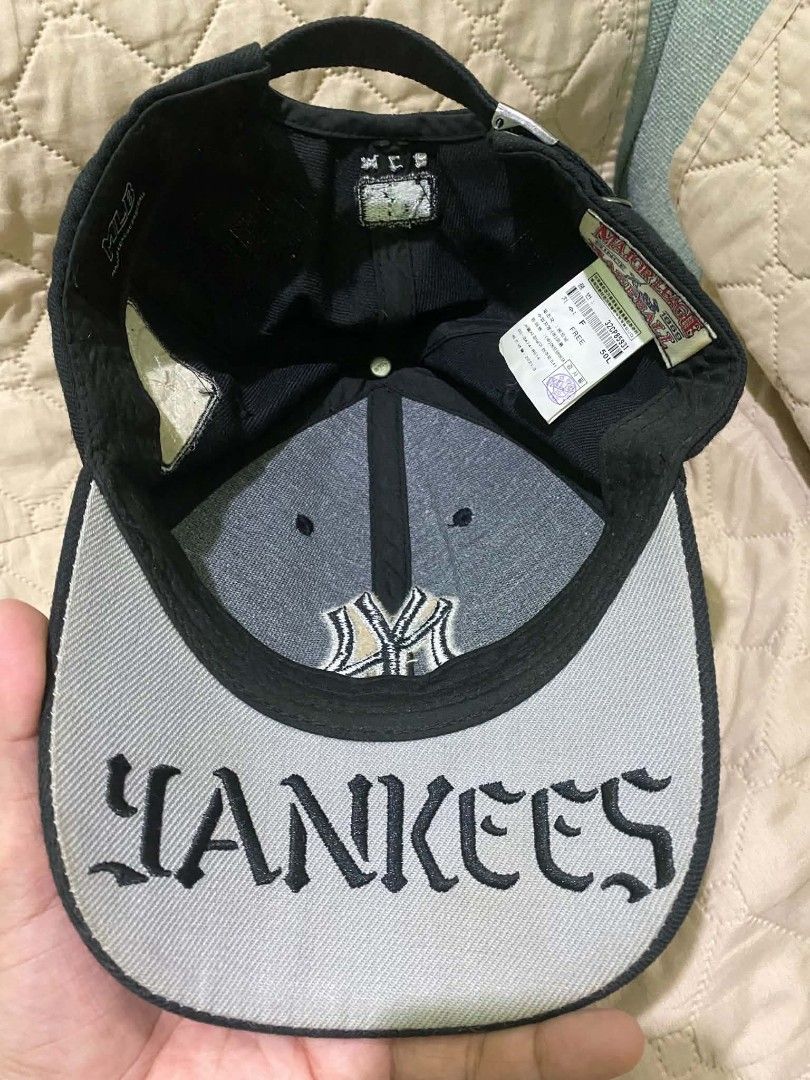MLB New York Yankees Black Cap Hat (Category: Caps & Hats) located in Quezon City. Submitted by elihur.tuazon (Listing ID 1467808773, Image 2). Description: - Authentic MLB New York Yankees baseball cap in classic black - Embroidered NY logo on front, side patch, and detailed script under the brim - Adjustable strap closure with metal hardware for a custom fit - Free size (unisex) - Interior tags intact - Versatile everyday staple piece - Ships f