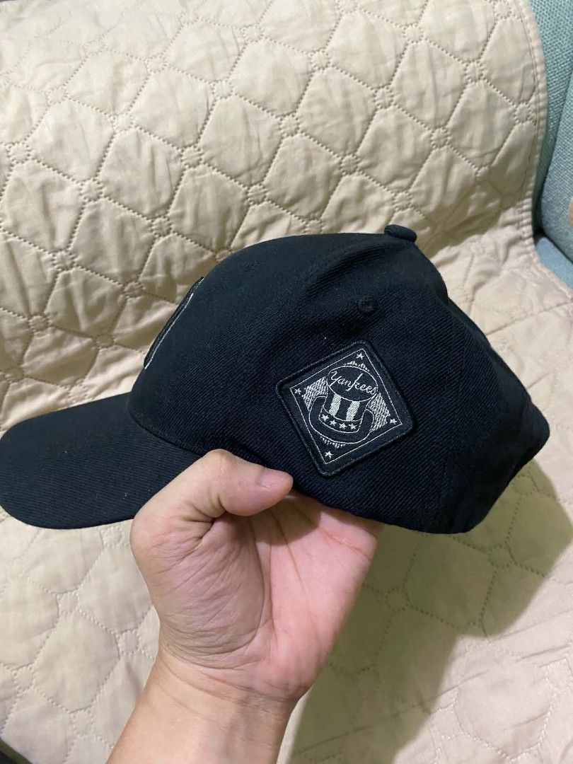 MLB New York Yankees Black Cap Hat (Category: Caps & Hats) located in Quezon City. Submitted by elihur.tuazon (Listing ID 1467808773, Image 3). Description: - Authentic MLB New York Yankees baseball cap in classic black - Embroidered NY logo on front, side patch, and detailed script under the brim - Adjustable strap closure with metal hardware for a custom fit - Free size (unisex) - Interior tags intact - Versatile everyday staple piece - Ships f