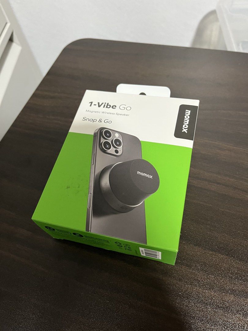 MOMAX Magnetic Wireless Speaker (Category: Other Gadgets) located in Caloocan City. Submitted by bloomstoday (Listing ID 1467673581, Image 3). Description: - Brand: MOMAX - Model: 1-Vibe Go Magnetic Wireless Speaker (BS6) - Color: Black - Condition: Brand new in box - Magnetic Attachment: Snaps easily onto your phone or metal surfaces - 2-in-1 Design: Functions as both a wireless speaker and a phone stand - Sound: True Wireless Stereo (TWS) for g