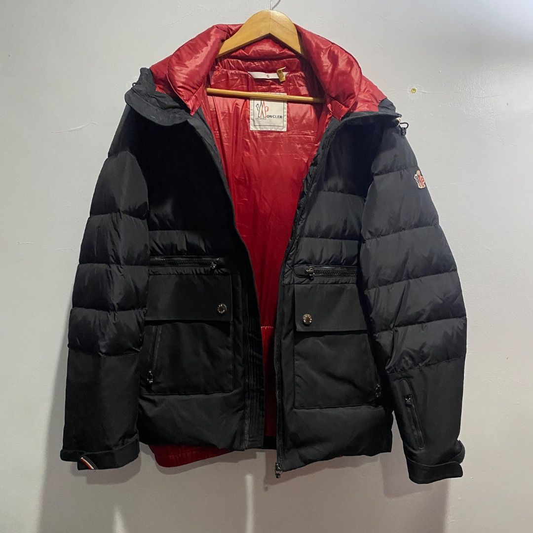 Moncler Grenoble Remarde Down Jacket M/L (Category: Coats, Jackets and Outerwear) located in Antipolo. Submitted by bentakahitanoano (Listing ID 1467782748, Image 3). Description: This item is a Moncler Grenoble Remarde Down Coat, specifically from the 2014–2015 Fall/Winter collection. It is designed as a technical utility winter jacket featuring prominent cargo-style chest and hand pockets, horizontal quilting, and a distinct contrast colored li