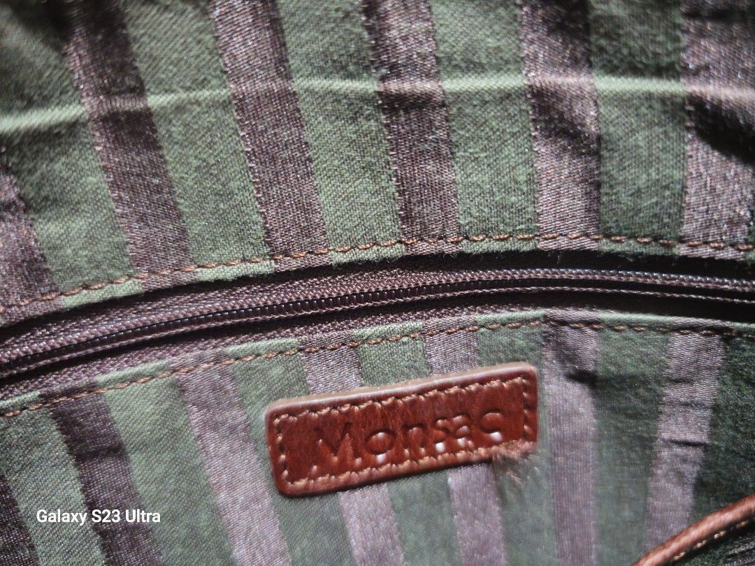 Monsac Authentic Genuine Soft Leather Sling Bag (Category: Sling Bags) located in Quezon City. Submitted by bagsforless16 (Listing ID 1467767142, Image 2). Description: Premium Genuine Soft Leather Complete Tags and Logos Gold Hardware Hardware Logos Zip Logo 2 Main Compartments with Organizers Back Zip Pocket Size: 12" x 12" .