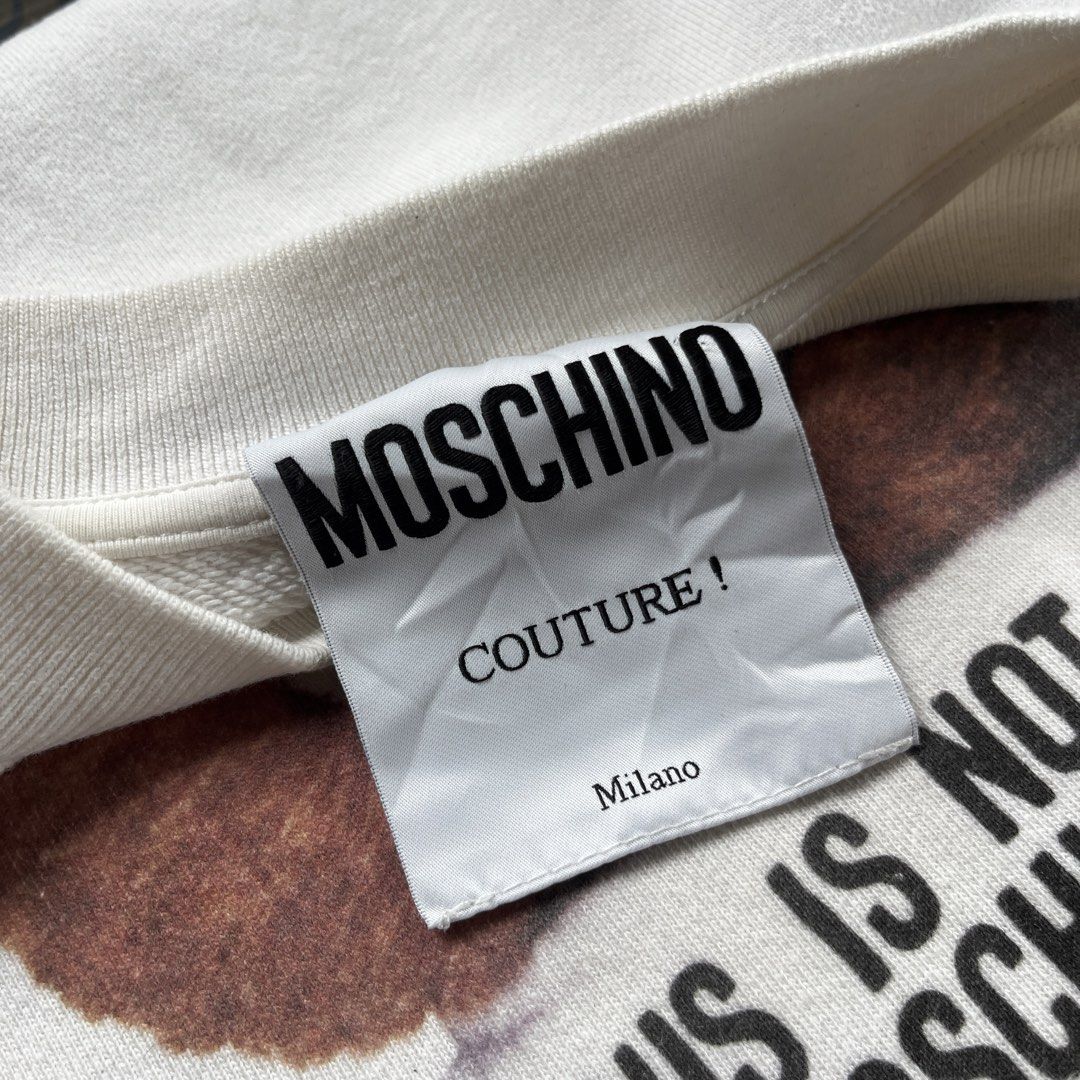 Moschino Couture Bear White Sweatshirt Size 36 (Category: Coats, Jackets and Outerwear) located in Manila. Submitted by thrifted4life (Listing ID 1467681475, Image 2). Description: - Moschino Couture crewneck - Size M - W:20.5 L:26 - Excellent Condition 9.8/10 - Light Stain.