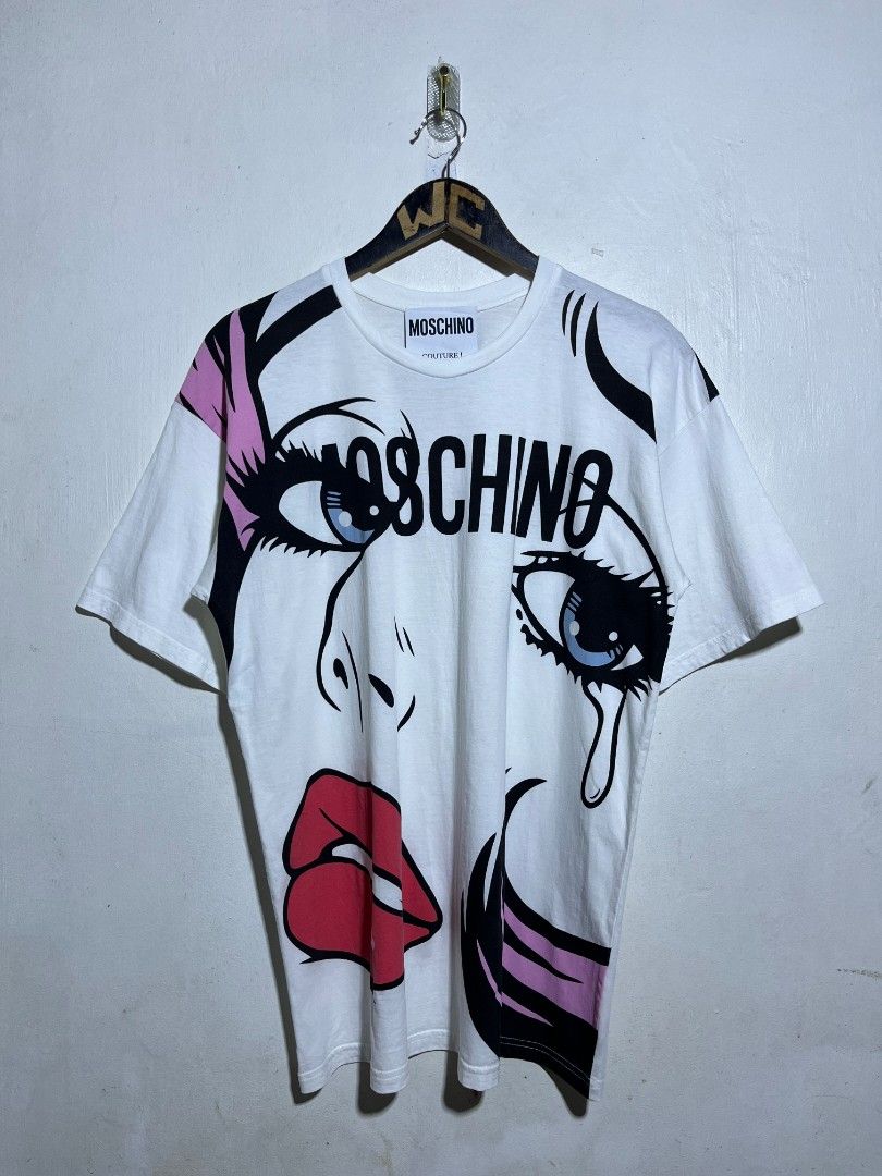 MOSCHINO COUTURE SHIRT (Category: Tshirts & Polo Shirts ) located in Dumaguete. Submitted by kingepoy (Listing ID 1467624941, Image 1). Description: Medium Width 20.5 / Length 28 Excellent Condition 9.8/10 Color Rate No issues.
