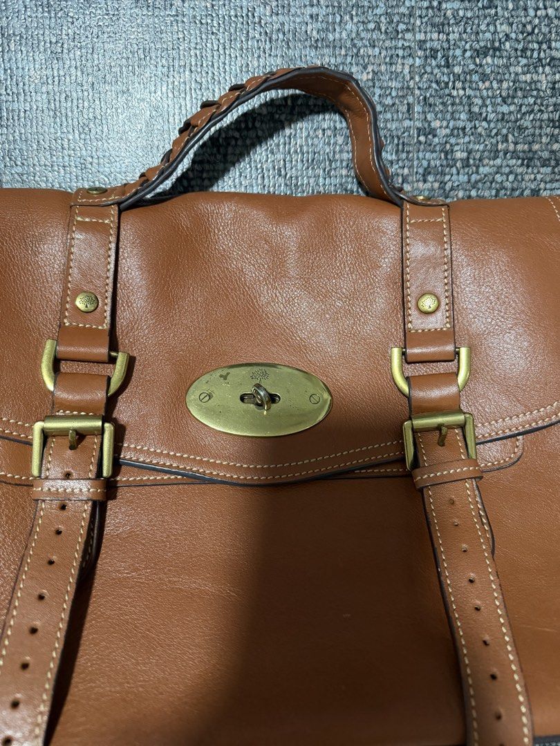 Mulberry Brown Leather Satchel Bag (Category: Luxury Bags & Wallets) located in Quezon City. Submitted by candyclosetph (Listing ID 1467754305, Image 2). Description: - Brand: Mulberry - Material: Rich brown leather with brass hardware - Design: Structured top handle, buckle strap details, and signature tree logo turn-lock closure - Interior: Spacious compartment with side gussets - Condition: Normal signs of wear on hardware and leather edges - 