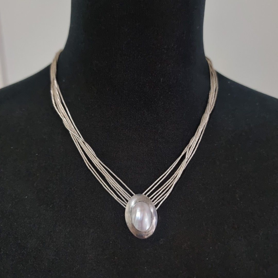 Multi-strand Necklace with Pearl Pendant (Category: Necklaces) located in Pasig City. Submitted by lesmitch (Listing ID 1467645310, Image 1). Description: - Multi-strand silver beaded design with tube beads - Features a smooth oval pendant with pearl stone - Vintage-inspired style that sits close to the collarbone - Length: 20 inc. ~ Check all photos for the item's actual condition and measurements ~ Payment is via gcash, pay maya or bdo ~ Shippi