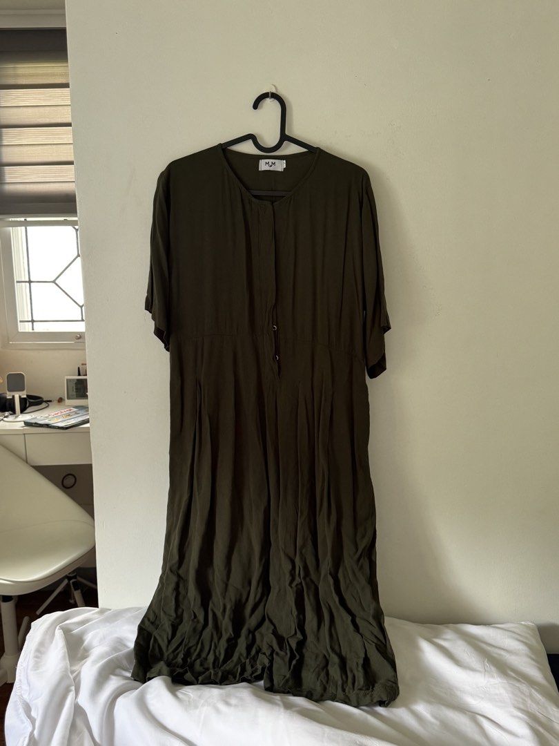 MUM Breastfeeding Romper Midi (Category: Dresses) located in Pasig City. Submitted by jazgarcia8 (Listing ID 1467696954, Image 1). Description: - Brand/Style: Olive green midi romper from Mum - Design: Round neckline, half sleeves, and button placket on the upper front - Material: Lightweight fabric, perfect for simple everyday wear - Note: Needs a quick steam or iron before wearing.