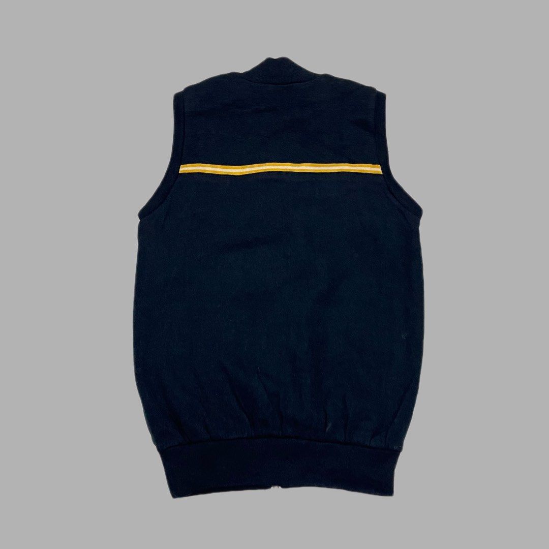 Munsingwear Houndstooth Zip Vest Navy Men Size M (Category: Vests) located in Manila. Submitted by frenzyyyy (Listing ID 1467627343, Image 2). Description: - Brand: Munsingwear - Style: Full-zip vest - Color: Dark navy blue - Size: M - Dimes: 19/26.5 - Features: Houndstooth pattern upper chest yoke, iconic embroidered penguin logo patch on left chest - Details: Stand-up ribbed collar, ribbed hem, and yellow/white horizontal stripe detail on upper