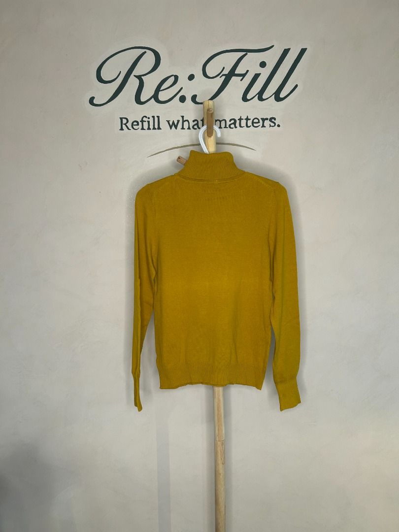 Mustard Yellow Turtleneck Sweater (Category: Longsleeves) located in Taguig. Submitted by re.wear.mnl (Listing ID 1467702481, Image 2). Description: - Brand: XXI - Size: Fits S-M, 21.5 x 17 inches - Color: Mustard yellow - Style: Turtleneck pullover with long sleeves - Details: Soft knit fabric, ribbed cuffs and hem, adorable polka dot bow accent inside the collar - Condition: Clean with minimal signs of wear.