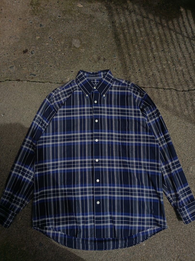 Nautica Blue Plaid Long Sleeve Button-Down Shirt (Category: Formal Shirts) located in Caloocan City. Submitted by reymartthrift (Listing ID 1467636719, Image 1). Description: - Brand: Nautica - Design: Blue, navy, and white plaid pattern - Style: Long sleeve button-down with classic collar and curved hem - Details: Single chest pocket with embroidered Nautica logo - Fit: Standard fit, great for casual days or layering - Condition: Excellent pre-l