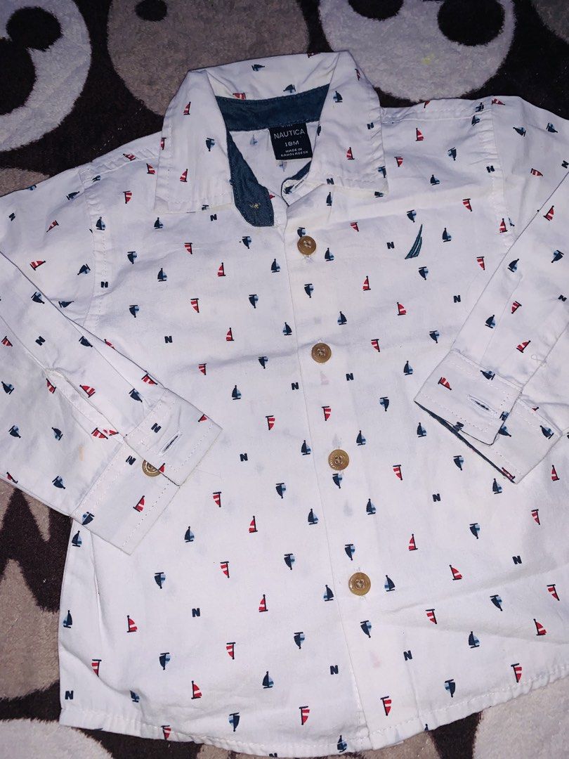 Nautica Polo Longsleeve (Category: Babies & Kids Fashion) located in Pasig City. Submitted by nyca1989 (Listing ID 1467773260, Image 2). Description: White long-sleeve button-down infant shirt from Nautica in size 18M, featuring an all-over nautical print of red and blue sailboats and letter “N” accents..