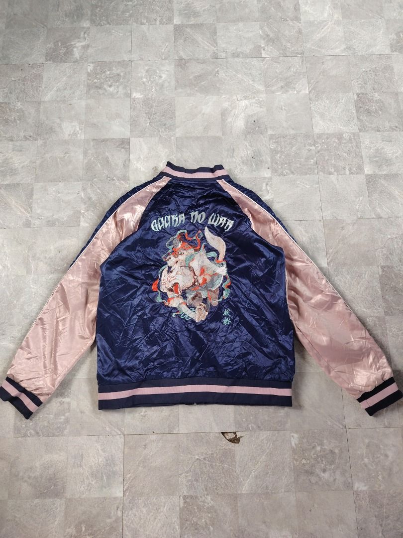Navy and Pink Satin Bomber Jacket with Embroidery (Category: Coats, Jackets and Outerwear) located in Dasmarinas. Submitted by clydegallo40531 (Listing ID 1467657490, Image 2). Description: - Color: Navy blue body with light pink sleeves - Material: Smooth satin finish - Design: Small green embroidery on the left chest - Details: Striped ribbing on collar, cuffs, and hem - Pockets: Two functional zippered side pockets - Closure: Secure front zip-
