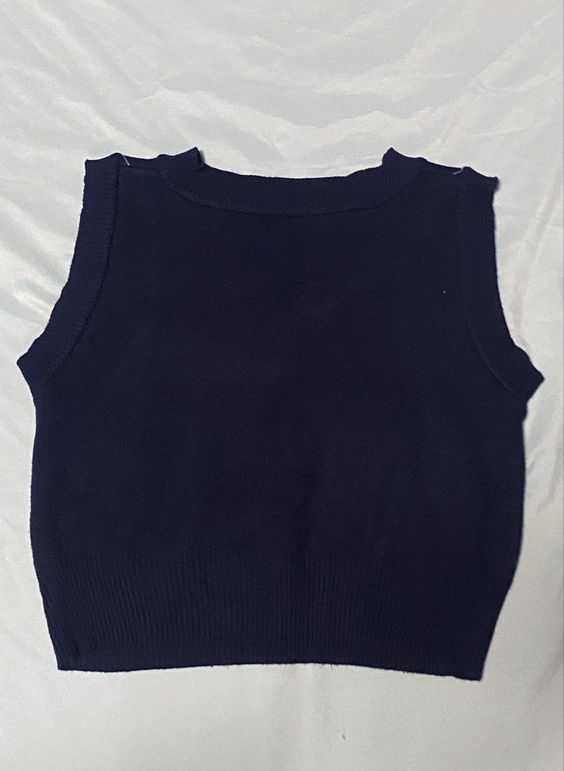 Navy Blue Argyle V-Neck Knit Sweater Vest (Category: Coats, Jackets and Outerwear) located in Paranaque City. Submitted by pomeloluvr (Listing ID 1467679653, Image 2). Description: - Color: Dark navy blue with light blue and beige argyle pattern - Design: Classic V-neck, ribbed hem, and solid plain navy back - Material: Soft and comfortable knit fabric - Styling: Perfect for layering over button-up shirts or wearing on its own - Condition: Excell